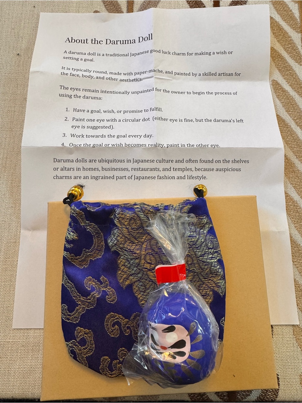 Blue Daruma Charm with Decorative Silk Pouch